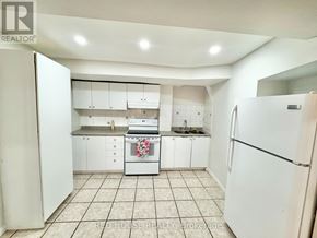 Richmond Hill (Devonsleigh) apartment for rent - A kitchen with white appliances and cabinets.