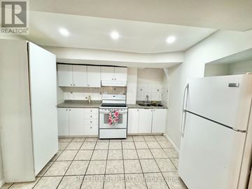 Richmond Hill (Devonsleigh) apartment for rent - A kitchen with white appliances and cabinets.