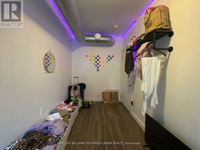 Toronto (Dovercourt-Wallace Emerson-Junction) apartment for rent - A room with a lot of clutter and a sign that says "KELLER WILLIAMS REFERRED URBAN REALTY Brokerage".