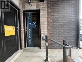 Guelph (Kortright East) townhouse for rent - A sign on a door reads "Welcome Home.".
