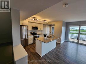 Ottawa condo for rent - A modern kitchen with a large island in the middle.