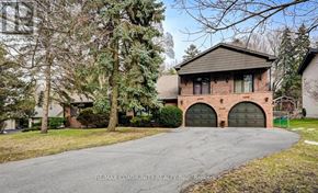 Toronto (Scarborough Village) apartment for rent - A house with a driveway in front of it.
