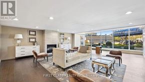 Markham (Thornhill) condo for rent - A well-lit living room with a fireplace and a large window.