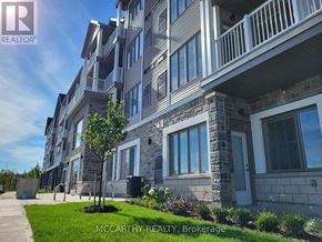 Southgate condo for rent - A building with a balcony and a tree in front of it.