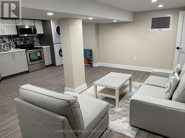 Toronto (West Hill) apartment for rent - A living room with a grey couch and a white coffee table.