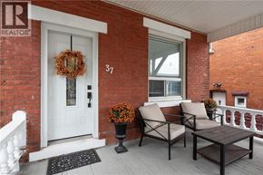 Hamilton apartment for rent - A white door with a wreath on it and a number 37 on it.