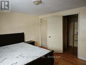Toronto (L'amoreaux) apartment for rent - A bedroom with a bed, dresser, and closet.