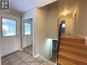 Markham (Bullock) apartment for rent - A hallway with a staircase leading to the second floor.