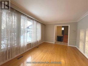 Markham (Bullock) apartment for rent - A room with wooden floors and a window with curtains.