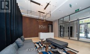 Hamilton (Beasley) condo for rent - A modern waiting area with a bench, a couch, and a coffee table.