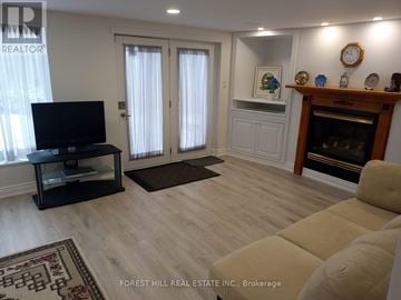 Markham (Thornhill) apartment for rent - A living room with a black television set on a stand.