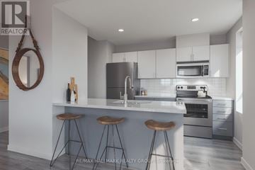 Ottawa condo for rent - A modern kitchen with a bar area and a large mirror on the wall.