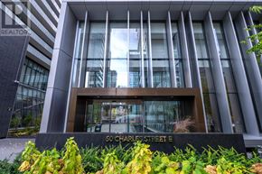 Toronto (Church-Yonge Corridor) condo for rent - A modern building with a glass facade and a sign that reads "50 Charles Street E".