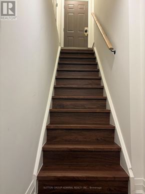 Vaughan (Maple) apartment for rent - A brown wooden staircase with white walls.