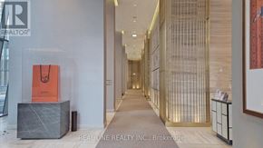 Toronto (Church-Yonge Corridor) condo for rent - A hallway with a sign that says Real One Realty Inc. Brokerage.
