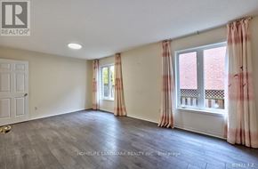Toronto (Steeles) apartment for rent - A room with a door, window, and curtains.