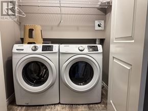London South (South W) townhouse for rent - Two front load washing machines in a laundry room.