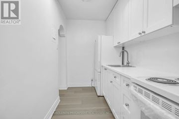 Toronto (Forest Hill North) apartment for rent - A white kitchen with a sink and cabinets.