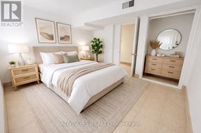 Burlington (Mountainside) apartment for rent - A bedroom with a large bed, a nightstand, and a dresser.