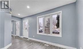 London East (East D) apartment for rent - A realtor brokerage image of a room with a window showing an outdoor view.