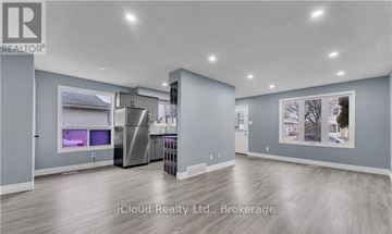 London East (East D) apartment for rent - A modern kitchen with stainless steel appliances and a refrigerator with a water dispenser.