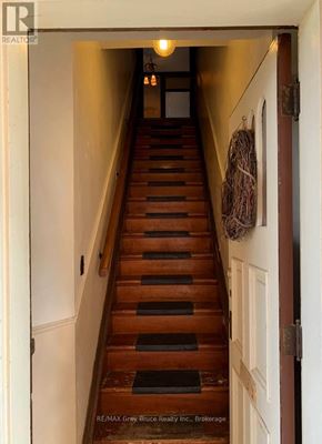 Owen Sound apartment for rent - A staircase with a light on at the top.