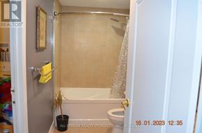 Toronto (Pleasant View) apartment for rent - A bathroom with a toilet, tub, and shower.