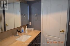 Toronto (Pleasant View) apartment for rent - A bathroom with a sink, mirror, and cabinets.