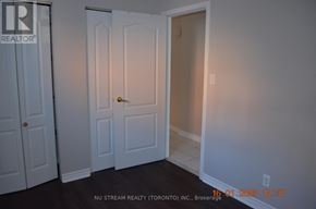 Toronto (Pleasant View) apartment for rent - A white door with a gold handle is in a room with white walls.