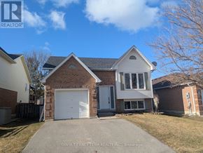 Clarington (Bowmanville) apartment for rent - A house with a white garage door is for sale.