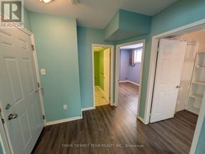 Clarington (Bowmanville) apartment for rent - A room with blue walls and a white door.