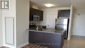 Markham (Cedarwood) condo for rent - A kitchen with a stainless steel refrigerator and microwave.