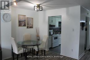 Brantford townhouse for rent - A dining room with a glass table and chairs.