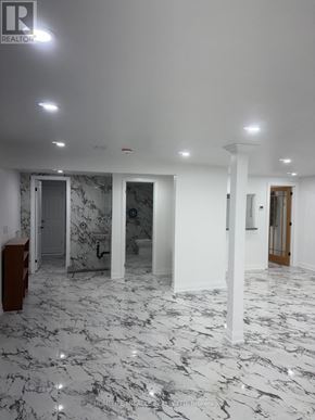 Welland (Lincoln/Crowland) apartment for rent - A spacious room with marble flooring and white walls.