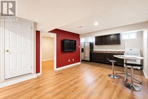 Vaughan (Vellore Village) townhouse for rent - A living room with a wooden floor and a red wall.