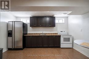 Vaughan (Vellore Village) townhouse for rent - A living room with a black chair and a television.