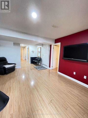 Vaughan (Vellore Village) townhouse for rent - A living room with a black chair and a television.