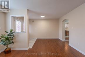 Brantford apartment for rent - A room with a plant in a pot and a window.