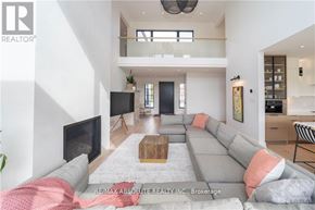 Ottawa apartment for rent - A modern living room with a grey sofa and a coffee table.