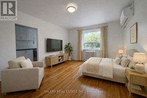 Toronto (Cabbagetown-South St. James Town) condo for rent - A bedroom with a bed, couch, and television.