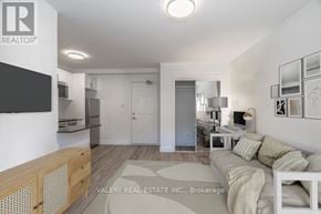 Toronto (Church-Yonge Corridor) condo for rent - A living room with a couch, a desk, and a television.