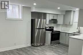 Ajax (Northeast Ajax) apartment for rent - A kitchen with a refrigerator, oven, and cabinets.