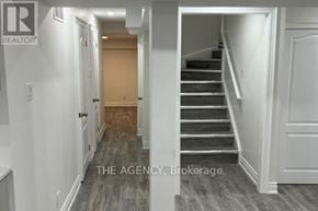 Ajax (Northeast Ajax) apartment for rent - A hallway with a staircase leading to the second floor.