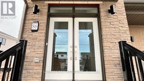 Welland (Dain City) apartment for rent - A real estate sign is on the front door of a house.
