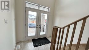 Welland (Dain City) apartment for rent - A realtor sign is on the wall above a door.