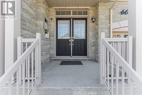 Markham (Cedarwood) apartment for rent - A black door with a glass window is flanked by white railings.