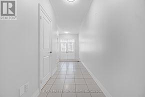 Markham (Cedarwood) apartment for rent - A long white hallway with a door at the end.