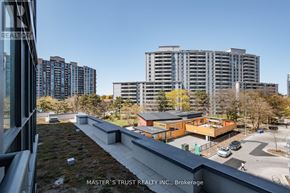 Toronto (Willowdale West) condo for rent - A view from a balcony of a building with the text "MASTER'S TRUST REALTY INC., Brokerage" on the balcony.