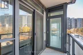 Toronto (Willowdale West) condo for rent - A balcony with glass doors and a railing.