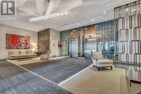 Ottawa condo for rent - A spacious office lobby with a large painting, a sofa, a chair, and a carpet.